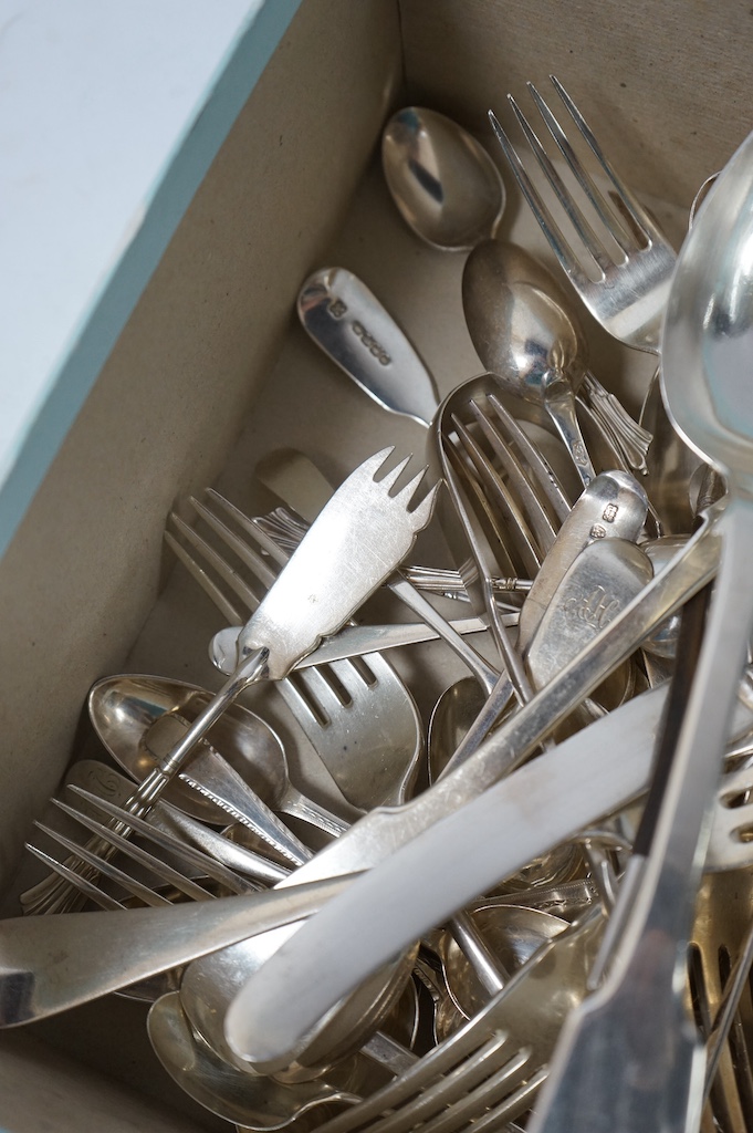 A quantity of assorted mainly 19th century silver flatware, various date, makers and patterns including a pair of George IV silver fiddle pattern table spoons, by William Cummins, Dublin, 1829, 33oz. Condition - poor to